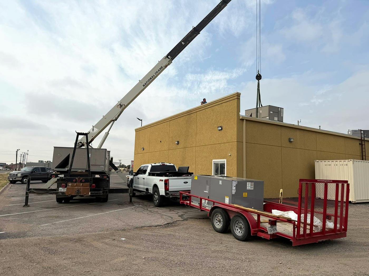Commercial rooftop HVAC unit replacement by crane in Odessa, TX — K & J Services of Texas